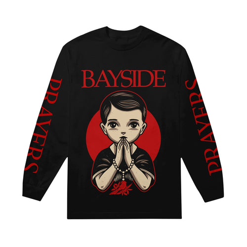image of a black long sleeve tee on a white background. full chest print that says in red print on the top bayside with an image of a young boy with his hands together as if he was praying with a rosery around his wrists with a red bird and leaves. both sleeves have full print in red that says prayers