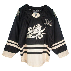 A black and beige hockey jersey by Bayside features a large bird on a branch graphic on the front, "25 Years Strong" with the number 25 on the chest, and striped accents on the sleeves and bottom.