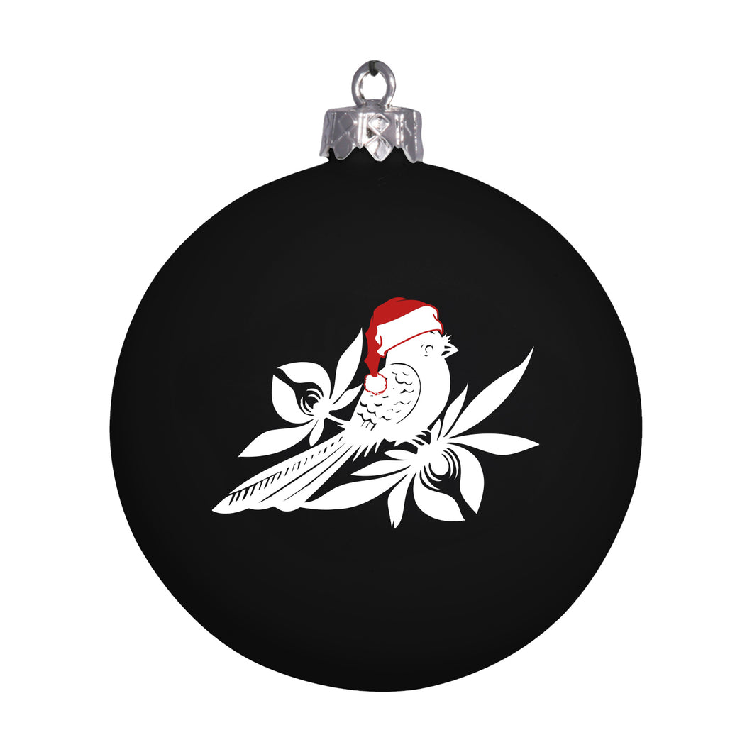 The Bayside shatterproof bulb Christmas ornament features a white bird in a red Santa hat, perched on stylized white branches and leaves.