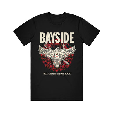 Bayside black T-shirt displays BAYSIDE in bold above an illustrated crow with open wings, a red heart, and a red circle; text below reads These years alone have eaten me alive.