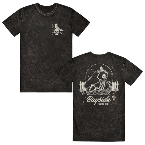 image of the front and back of a black mineral wash tee shirt on a white background. front of the tee is on the left and has a small chest print in white of a skull head and a bird. vertically on the left says bayside. the back of the tee is on the right and has a back print in white of a skeleton opening up a coffin. below that says bayside bury me