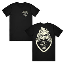 Load image into Gallery viewer, image of the front and back of a black tee shirt on a white background. front of tee is on the left and has a small right chest print of a heart and says bayside at the top. back of the tee is on the right and has a burning skeleton holding a heart that says go to hell