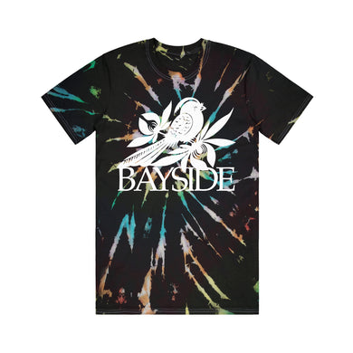 image of a black with rainbow spiral tie dye tee shirt on a white background. front of the tee has a center print of a white bird that says bayside