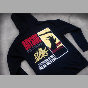 image of the back of a black pullover hoodie on a concrete background. hoodie has a full print of a hand coming out of water, bayside, a bird and the words to drown in the ocean with you.